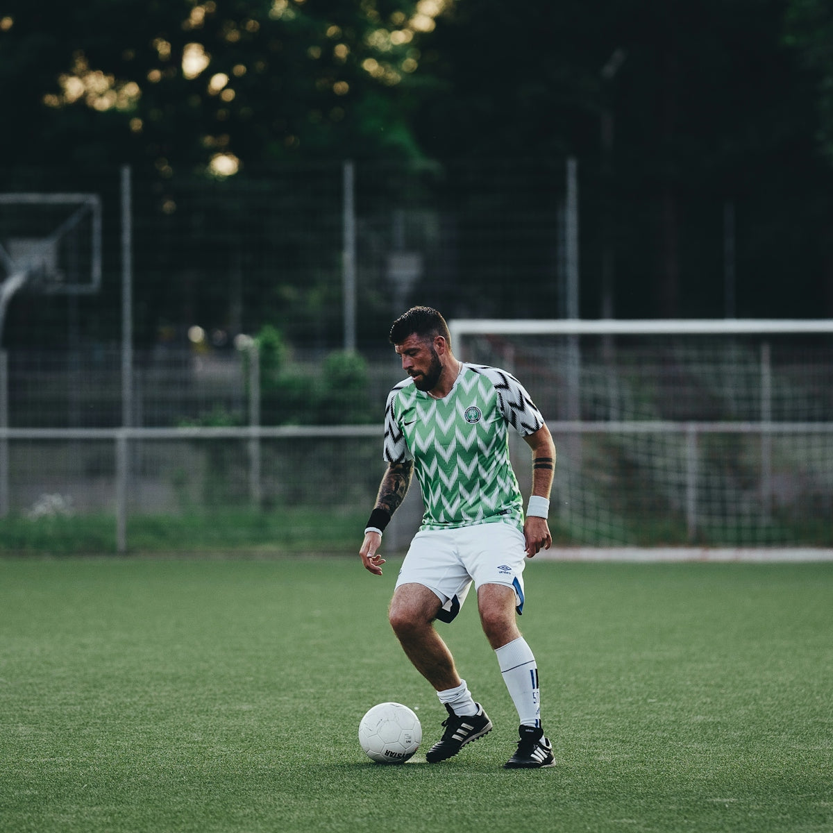 a man standing on top of a soccer field