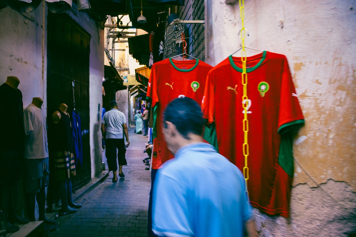 Moroccan jerseys hanging in a narrow alley.